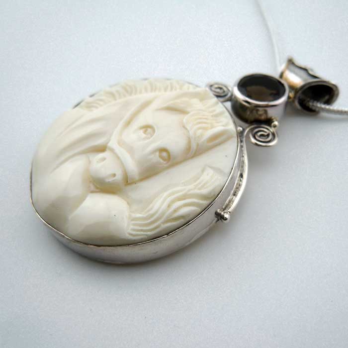 Cara carved horse head pendant necklace with topaz accent