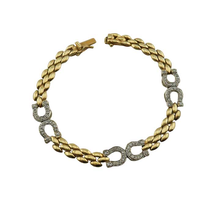 14k Gold horseshoe bracelet and necklace set. Shown is bracelet