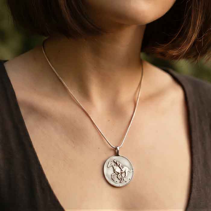Galloping racehorse and jockey pendant necklaca in Sterling Silver shown on person