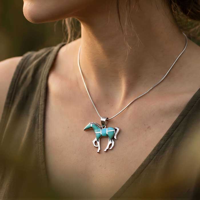 Turquoise Inlay Horse Pendant Necklace shown on horse lovers neck