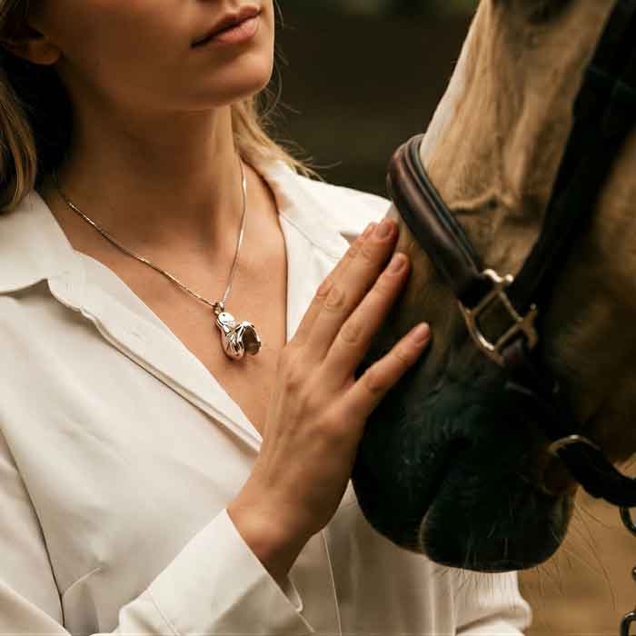 English Saddle Necklace Sterling Silver shown on a woman with horse