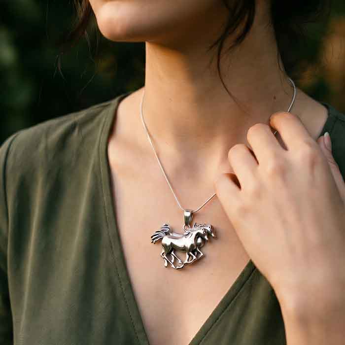 Span of Horses Necklace in Sterling Silver. Two horses side by side, stride for stride shown on horse lover