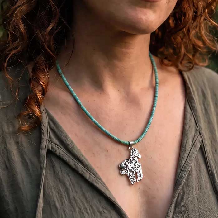 Storyteller horse pendant in sterling silver on turquoise necklace shown on horse lover