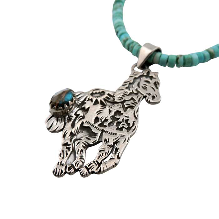 Storyteller horse pendant in sterling silver on turquoise necklace