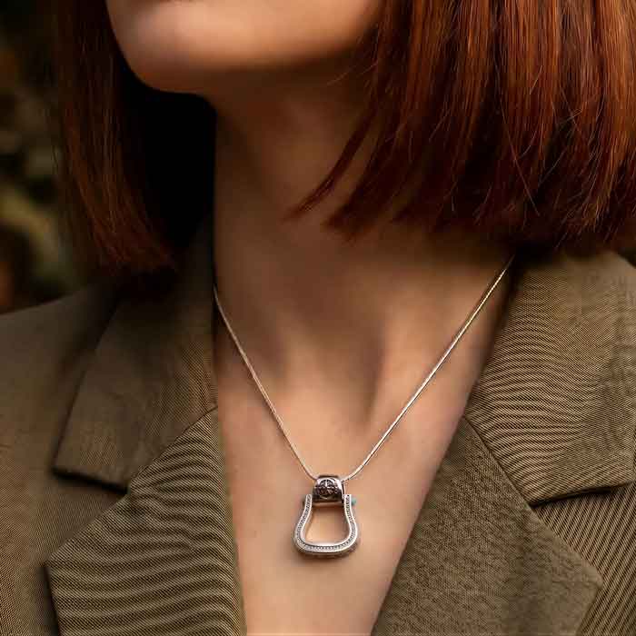 Western Stirrup Pendant Necklace Sterling Silver shown on horse lovers neck