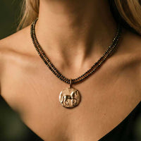 Piaffe Dressage Horse Pendant Necklace in bronze  shown on neck of horse lover