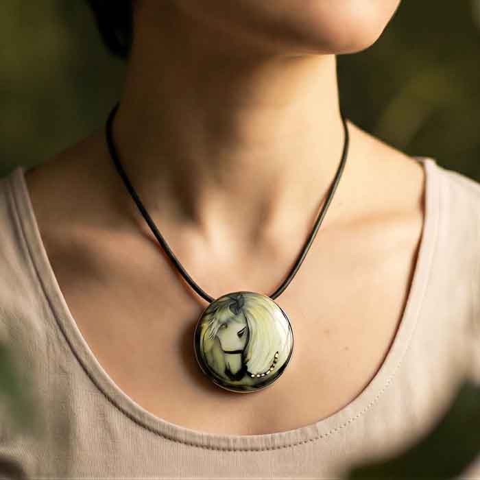 Cloisonne White Pony Pendant Pin shown on horse lover's neck