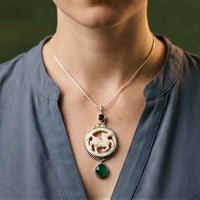 Darcy Carved Horse Pendant Necklace with garnet and green chrome diopside shown on person