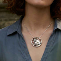 Carriage Horse Pendant Necklace in Sterling Silver shown on a carriage driving person