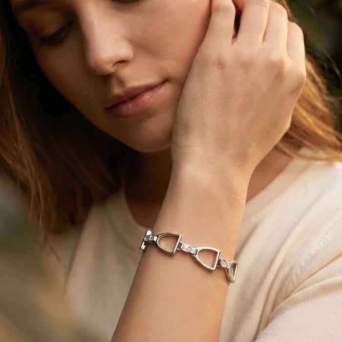 English stirrup bracelet in sterling silver shown on person
