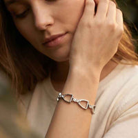 English stirrup bracelet in sterling silver shown on person