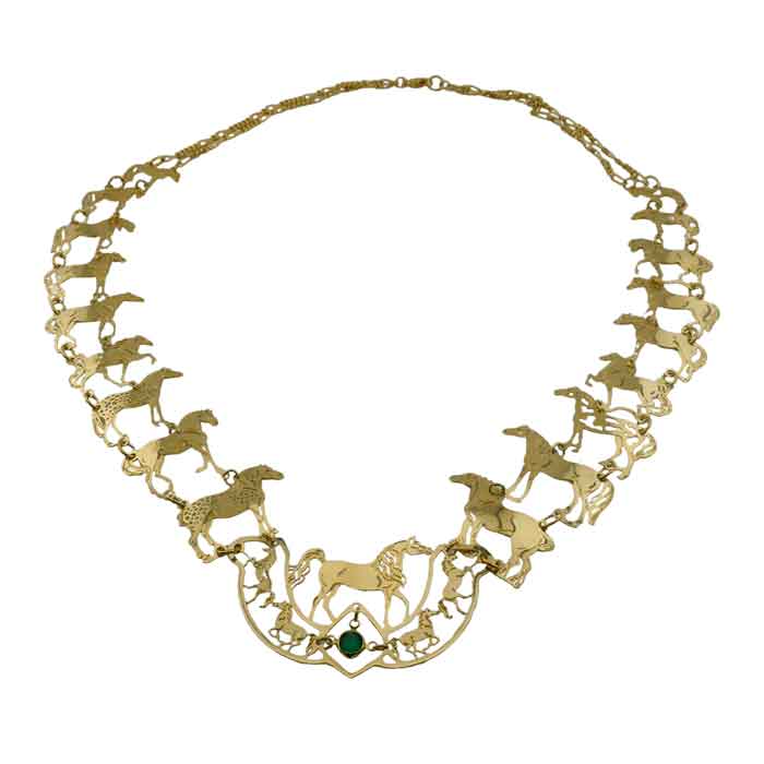 A gold-toned statement necklace featuring multiple horse silhouettes and a central horse motif with a small green stone accent, displayed on a plain white background.