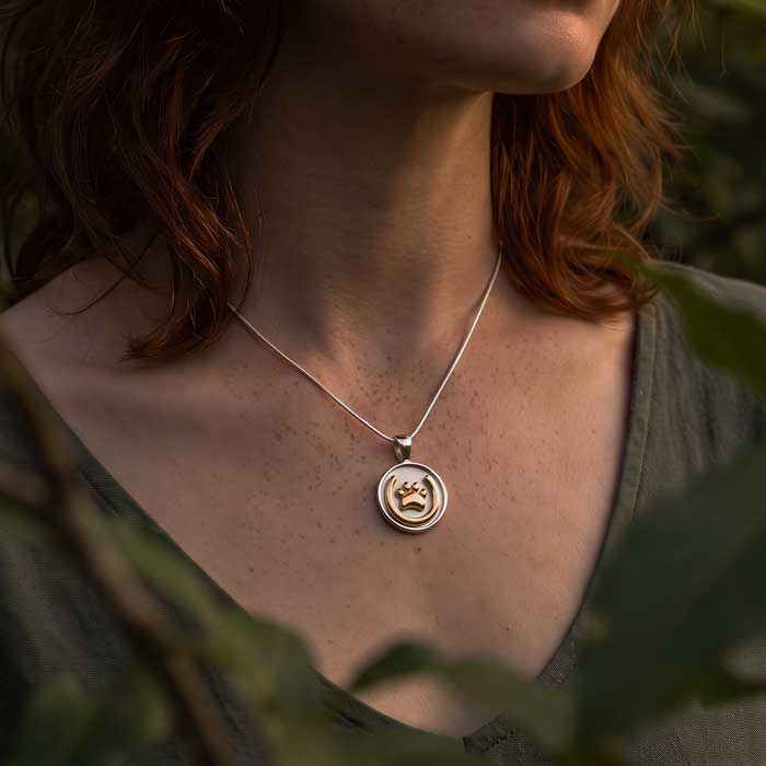 Horseshoe and Paw Print Pendant Necklace, 18k Gold and Sterling Silver  shown on neck of horse lover