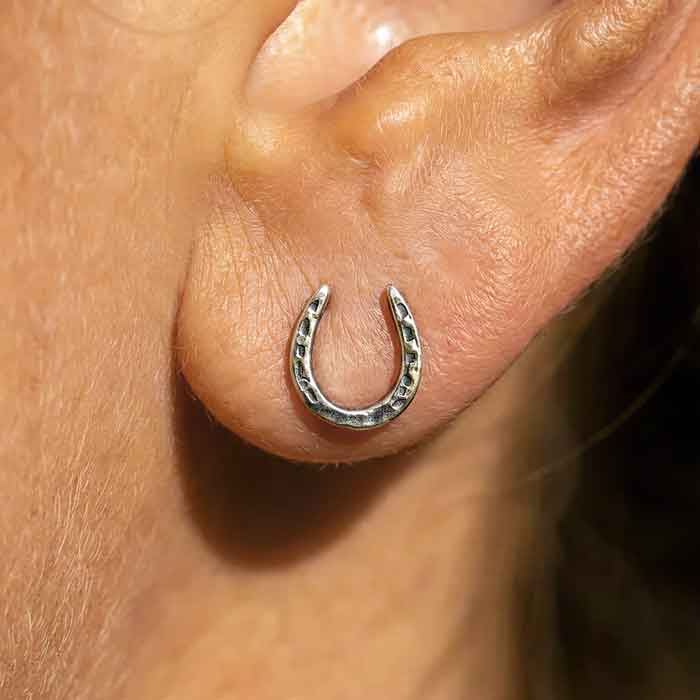 Horseshoe Earrings Sterling Silver on model's ear