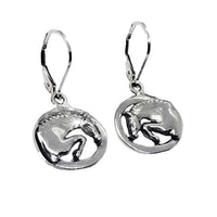 A pair of sterling silver dangle earrings featuring a silhouette of a jumping horse with its knees tucked up.