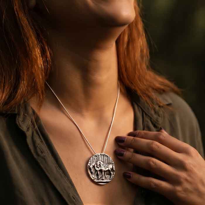 Pair of Saddled Horses Pendant and Pin Sterling Silver shown on person wearing t