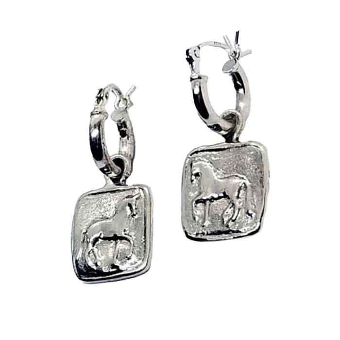 A pair of sterling silver hoop-style dressage horse earrings, with the hoops in a silver finish and the horses engraved on a square or round charm.