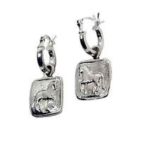A pair of sterling silver hoop-style dressage horse earrings, with the hoops in a silver finish and the horses engraved on a square or round charm.