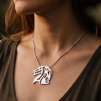 Raffles Horse Head Pendant Necklace in Sterling Silver shown on a horse lover's neckline
