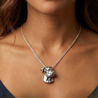 Rottweiler Pendant Necklace In Sterling Silver shown on dog lover's neck
