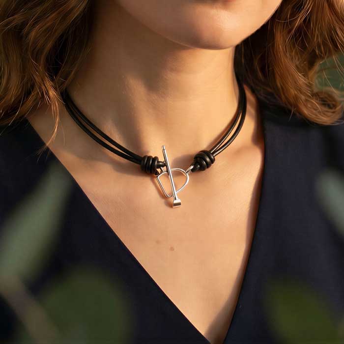 Sterling Silver Stirrup and Crop on Leather Choker shown on neck of horse lover