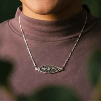 Three day eventing horses pendant necklace in Sterling Silver shown on person