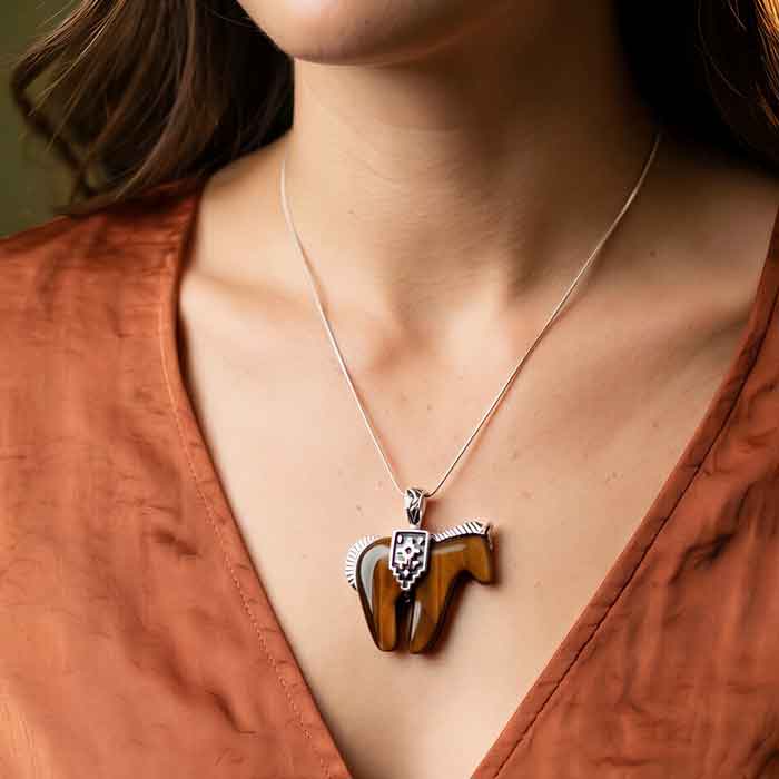 Tiger eye horse pendant necklace with Sterling Silver shown on person