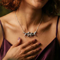 Traveling Horses Necklace Sterling Silver shown on neckl of hore lover
