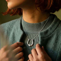 Troika horseshoe necklace sterling silver show on person