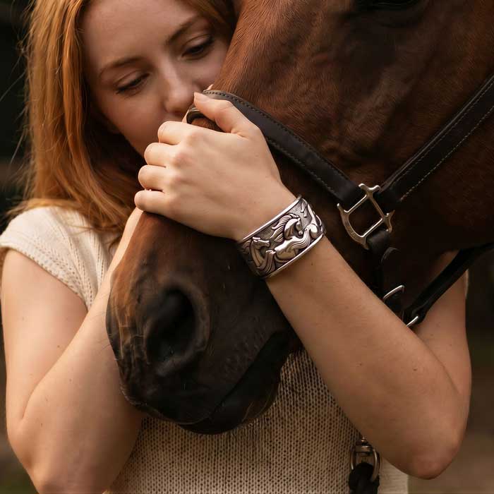 Wide Flowing Horses Cuff Bracelet Sterling Silver show on woman who is hugging horse