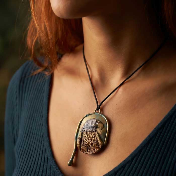 bronze-eagle-pendant bas relief shown on neck of woman