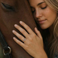 Horseshoe Ring with a Twist Sterling Silver shown on horse lover's hand
