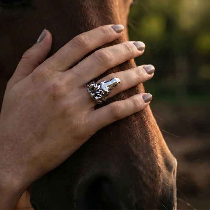Mustang Ring in Sterling Silver shown on hand resting on horse's face
