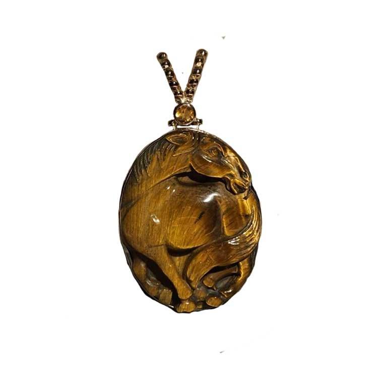 A Tiger Eye gemstone horse pendant necklace with a sterling silver chain and intricate vermeil beadwork.