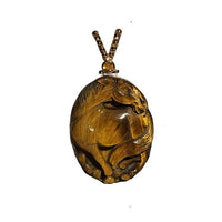 A Tiger Eye gemstone horse pendant necklace with a sterling silver chain and intricate vermeil beadwork.