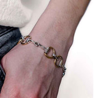 Two Tone Snaffle Horse Bit Bracelet Sterling Silver on wrist with jeans