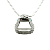 Western Stirrup Pendant Necklace Sterling Silver with turquoise accent looking at it from the bottom showing the intricate "tooling" arund the sitrrup