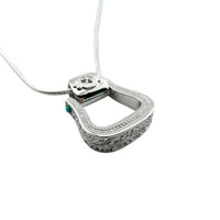Western Stirrup Pendant Necklace Sterling Silver with turquoise accent shown side to highlight the intricate design around edge like tooling