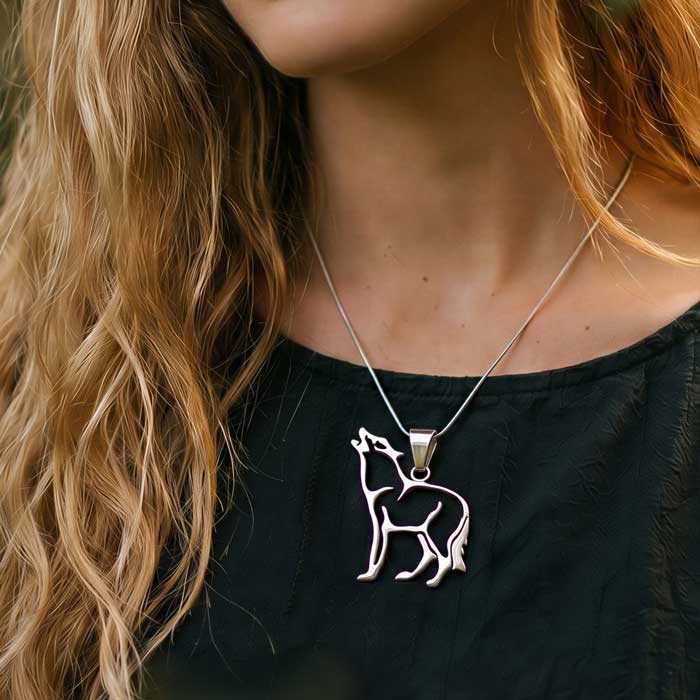 Wolf Pendant Necklace in Sterling Silver shown on woman