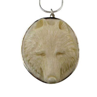 Carved Wolf Head Pendant Necklace set in sterling silver frame